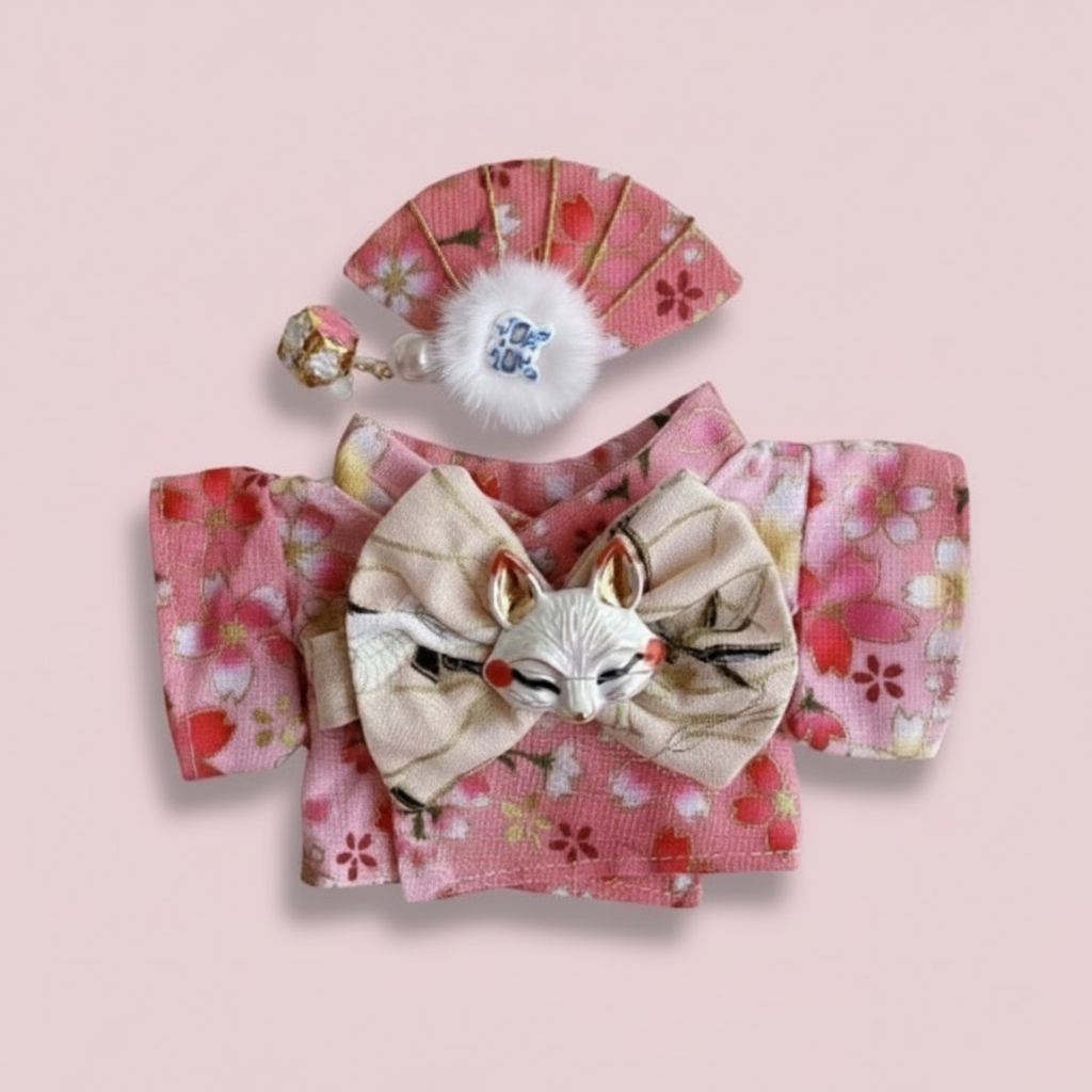 Traditional Japanese hair accessory with fox design on a pink background